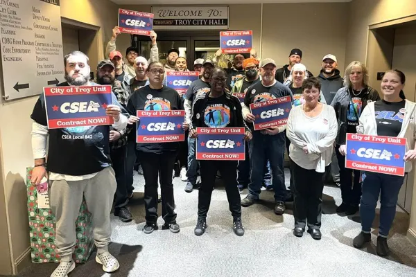 Troy CSEA members rallying outside Troy City Council meeting holding signs