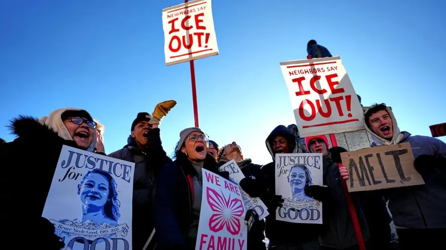 Protesters chanting and holding signs that say, "ICE OUT!" and "Justice for Renee Good"