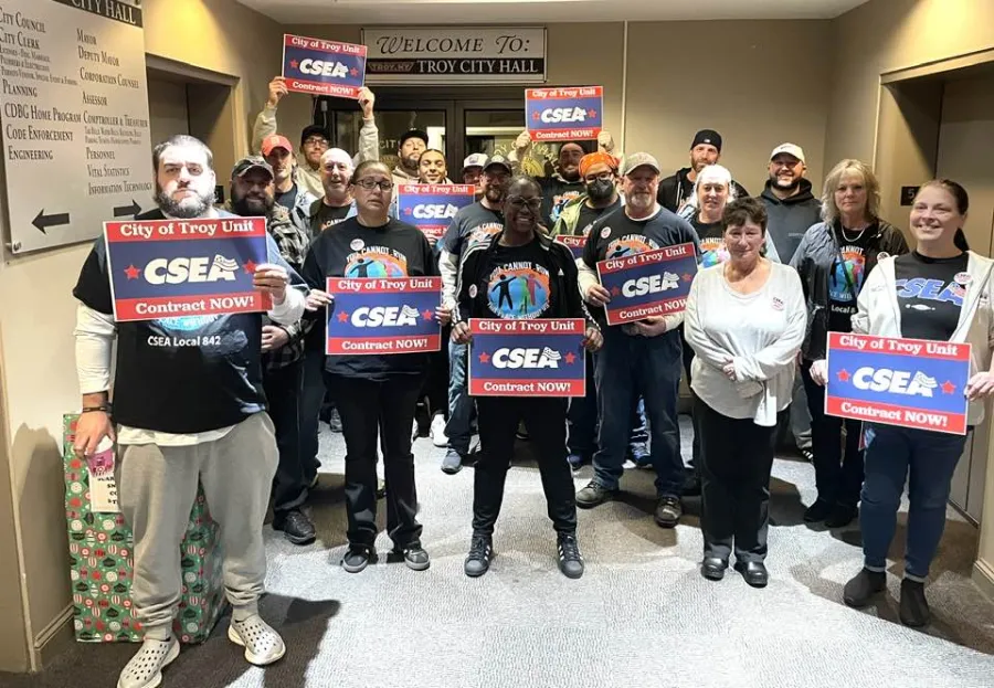 Troy CSEA members rallying outside Troy City Council meeting holding signs